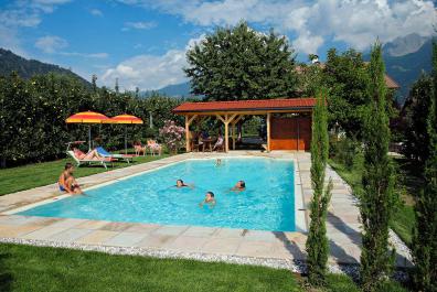 Garden with pool and sunbathing lawn