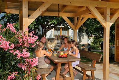 The roofed sitting area protects you from the sun on hot summer days