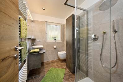 Bathroom with large shower and window